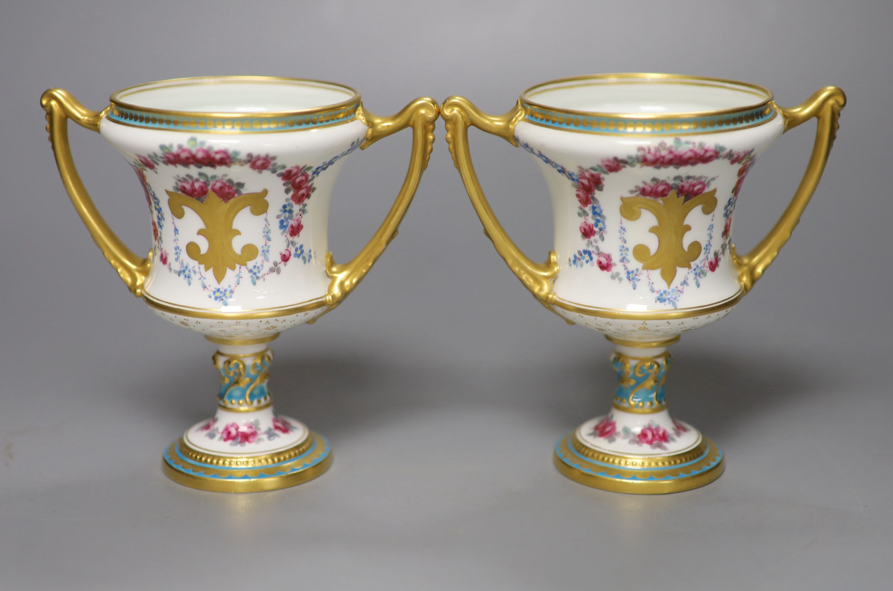 A pair of Royal Crown Derby two-handled campana-shaped urns, height 13cm